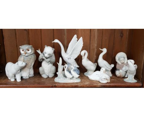 Lladro polar bear, Lladro Inuit child with polar bear cub and Lladro swan preening with Nao owl and Nao panda and 5 assorted 