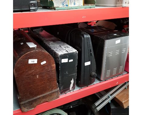 A Singer sewing machine in wooden case, Mira Azora electric shower, Sharp electronic typewriter, Cuisinaire bread maker