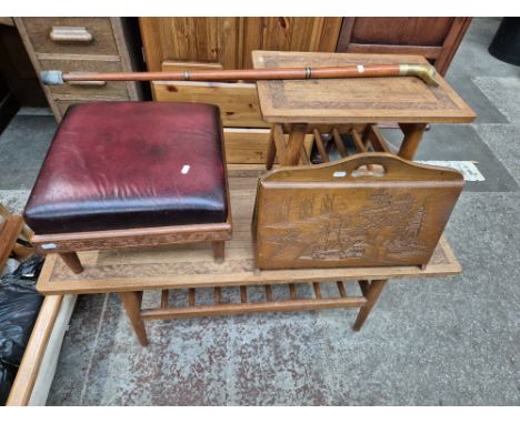 A group of eastern carved teak furniture comprising of a coffee table, footstool, magazine rack, side table &amp; a brass duc