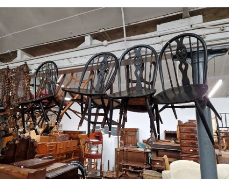 A set of four Ercol 'Fleur de Lis' dining chairs. 