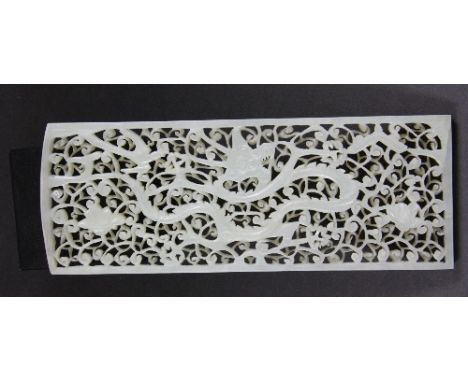 An intricately carved Chinese celadon jade miniature screen panel decorated with a dragon H 15cm W 5.5cm