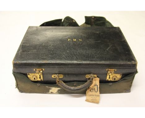 A vintage leather suitcase with silk lining and velvet lined cover 52cm x 35cm x 19cm