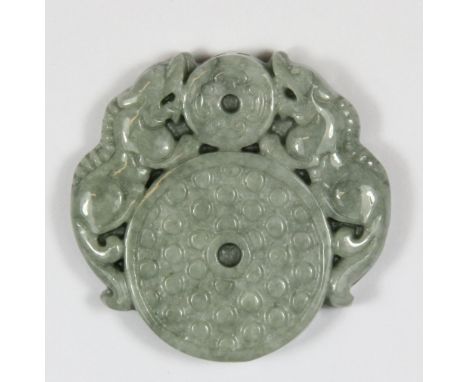 A Chinese jadeite jade amulet of 2 dragons with discs 5.3cm x 5.5cm