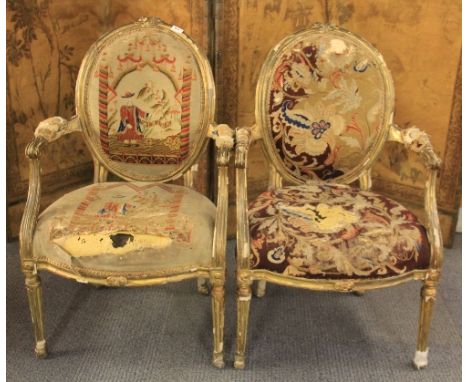 A pair of 18th century French gilt decorated and tapestry covered arm chairs. Prov. Barmoor Castle, Northumberland. Mary Sitw
