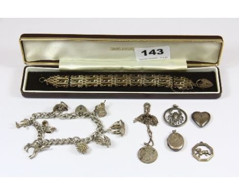 A silver gate bracelet, charm bracelet etc