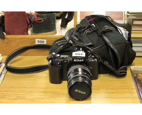 A Nikon F-601 SLR camera with a Nikkor 28-85 lens