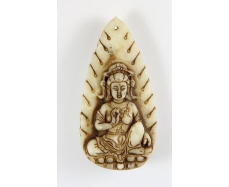 A Chinese carved jade/hardstone Guanyin amulet H 7.5cm
