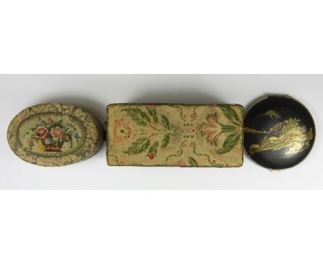 A woven silk covered oblong tin, an oval box with tapestry decoration and a Japanese compact