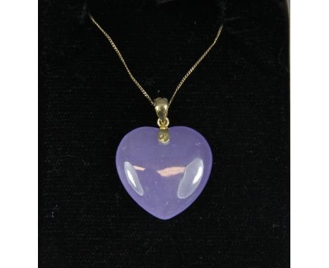 A lavender jade heart pendant mounted in yellow metal on a 9ct gold chain