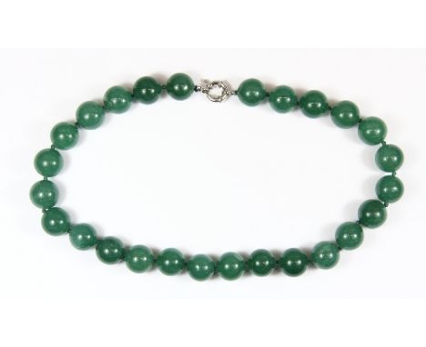 A single strand of large (15.5mm) jade/hardstone beads