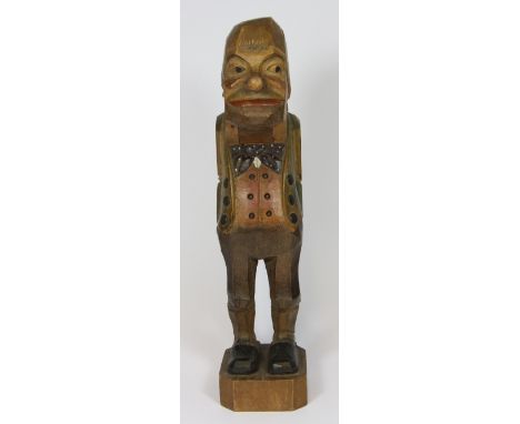 A signed large carved wooden Black Forest nutcracker H 31cm