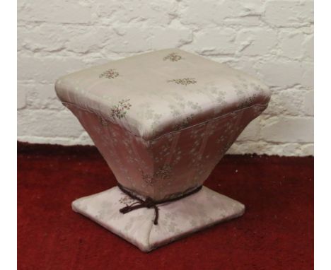 An unusual sarcophagus shaped boudoir stool in pink floral upholstery.
