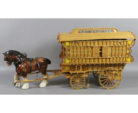 A large detailed match stick made gypsy caravan with full interior lay out, along with pottery shire horse.