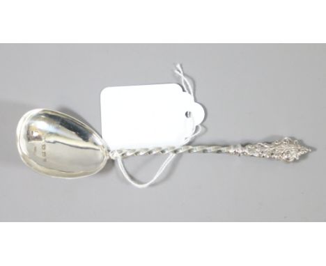 A Victorian silver caddy spoon with twisted handle, assayed Birmingham 1874, 14.66 grams.