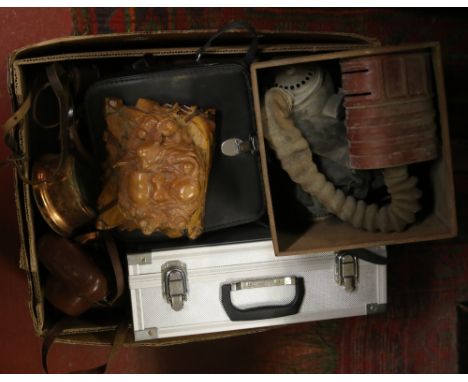 A box of miscellaneous to include World War I gas mask, cameras, clocks, boxed projector, cased drill, carved Buddha, etc.