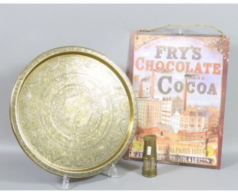 A modern Frys enamel sign along with an Indian brass dish and a small brass miners lamp.