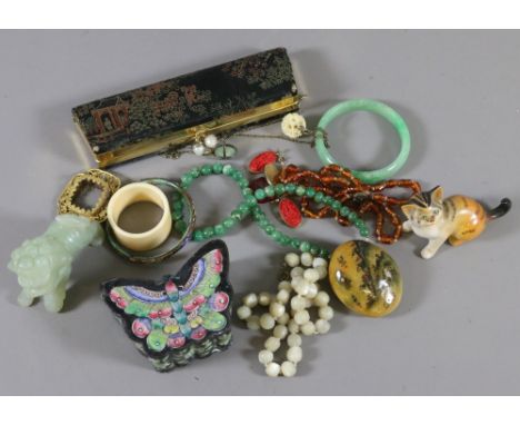 A box containing Chinese jade items, amber, enamelled box, jewellery etc.