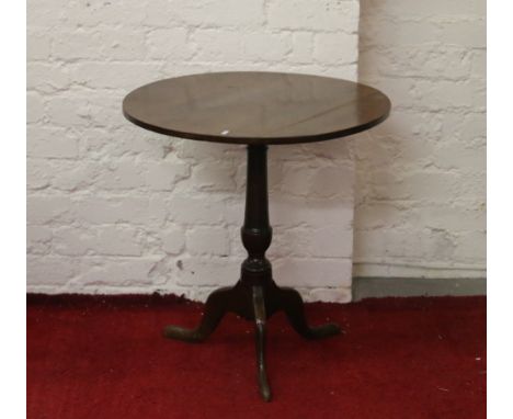 An oak tripod wine table.