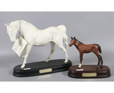 A Royal Doulton bisque model of a horse 'Spirit of Freedom' raised on wooden plinth along with another bisque Royal Doulton f