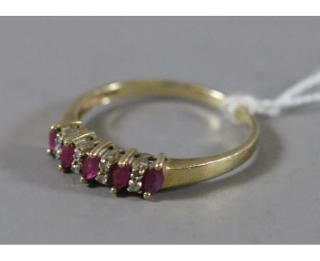 A ladies 9ct gold ruby and diamond set dress ring, 1.53 grams.