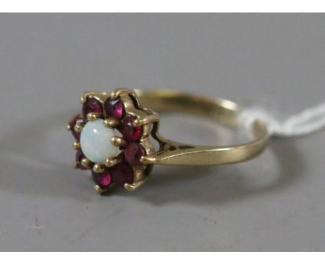 A ladies 9ct gold ruby and opal cluster ring, 1.64 grams.