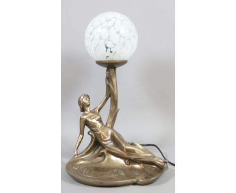 A bronzed based Art Deco style figural table lamp and shade.