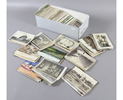 A shoe box of approximately five hundred postcards including monochrome, topographical and portrait.