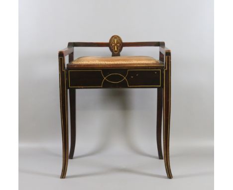 A Victorian inlaid mahogany piano stool/seat with under seat storage and raised on tapering splay feet.