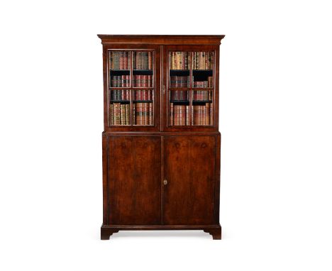 A George I walnut cabinet bookcase, circa 1720, the moulded cornice above a pair of astragal glazed doors opening to adjustab