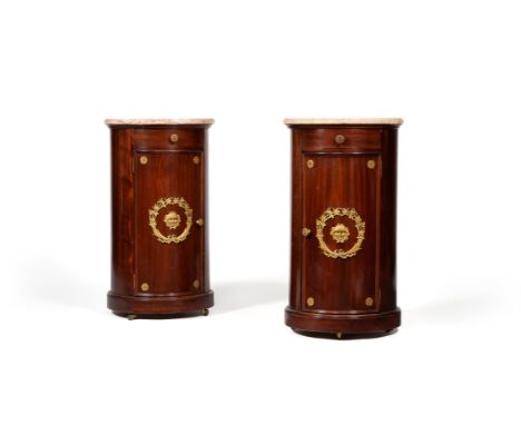 A pair of mahogany and gilt metal mounted cylindrical nightstands, in Empire style, 20th century, each circular variegated ma