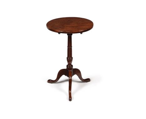 A George III mahogany tripod table, circa 1780, the hinged circular top above a turned tapering stem, on outswept tapering ca