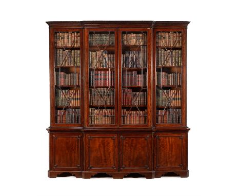 A mahogany breakfront library bookcase, in George III style, mid 19th century, the moulded cornice above four astragal glazed