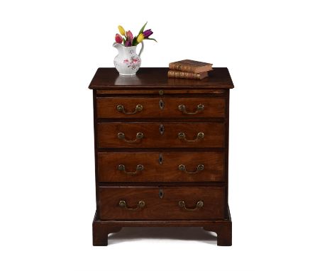 A George III mahogany chest of drawers, circa 1780, the moulded rectangular top above a slide and four graduated drawers, on 
