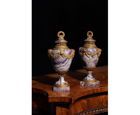 A pair of fine and rare French banded amethyst quartz and ormolu mounted pot pourri urns and covers, 19th century, each domed