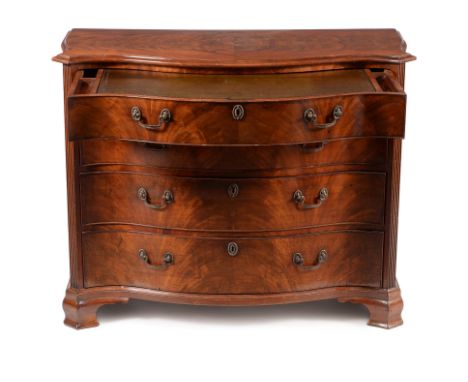 A George III mahogany serpentine dressing chest, circa 1770, in the manner of Gillows, the shaped top with moulded edge above