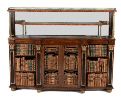 A Regency rosewood and brass mounted breakfront side cabinet, circa 1815, the raised mirror back superstructure surmounted by