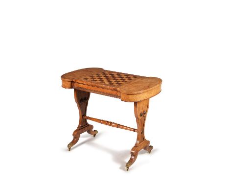 A Regency burr elm library games table, circa 1815, in the manner of William Trotter, the top with central sliding panel with