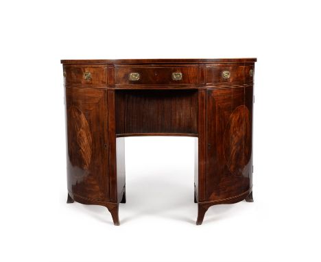 A pair George III figured mahogany side cabinets or serving tables, circa 1810, in the manner of Thomas Sheraton, each demi-l