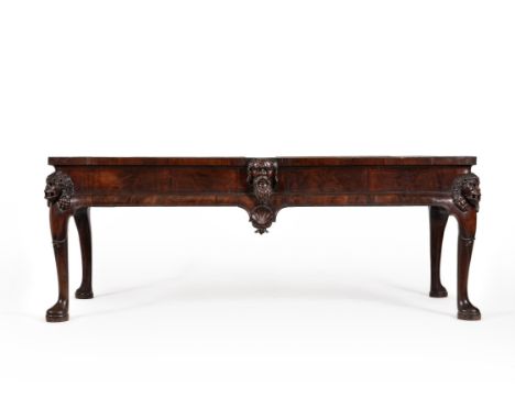 An Irish George II mahogany console or side table, circa 1730, the moulded frieze centred by a carved mask of a bearded man, 