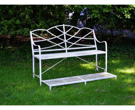 A Regency white painted cast and wrought iron 'games seat', first quarter 19th century, the reeded and slatted frame with arc