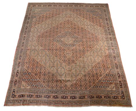 A Tabriz Hadjijalili carpet, the sectional geometric field decorated overall with overall designs of stylised foliate motifs,