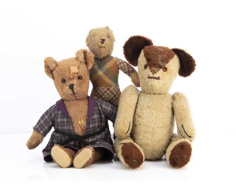 Three British 1940s teddy bears,   a brown wool plush teddy bear with orange and black glass eyes, black stitched nose mouth 