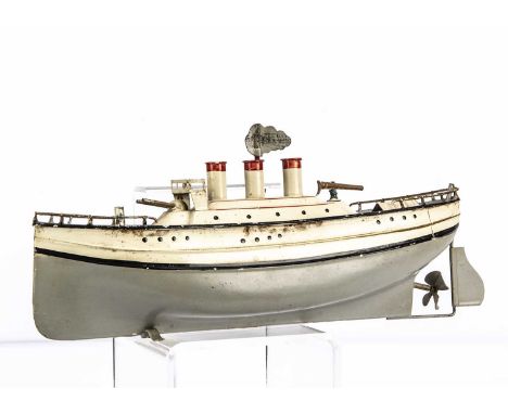 A Fleischmann clockwork painted tinplate gun boat, painted cream and grey with black, red and gold lining, three funnels, two