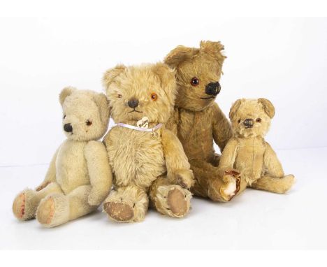 Four post-war Chad Valley teddy bears,  a blonde mohair with orange and black glass eyes, black stitched nose and mouth, head