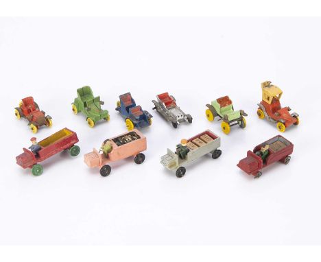 Four Erzgebirge wooden trunks, one with metal spoked wheels —2 1/4in. (6cm.) long; and others with tinplate; three diecast ol