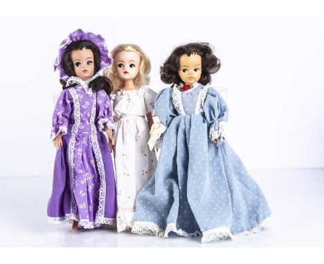 Three Sindy dolls, a blonde Sindy in First Romance, 1985; and two brunette Sindys, all with bendable legs