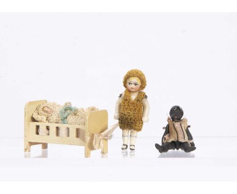 An all-bisque dolls’ house doll,  probably Horn, with blue painted eyes, blonde painted hair, crochet dress and hat —1 3/4in.