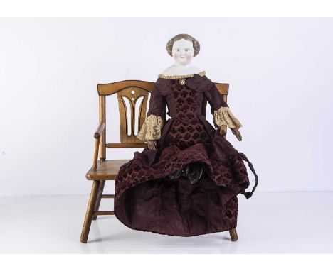 A 19th century German bisque shoulder-head doll, probably Alt, Beck & Gottschalck with unusual light brown painted and moulde