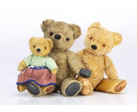 Three post-war Chad Valley teddy bears, including a small golden mohair with orange and black glass eyes, black stitched nose