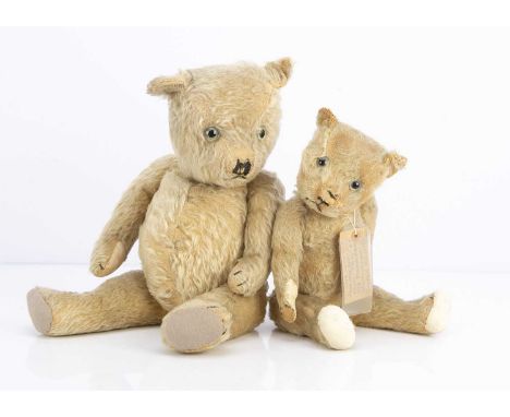 Two 1930s Chiltern type teddy bears,  the smaller teddy bear with blonde mohair, known as Phyl's teddy bear, with clear and b